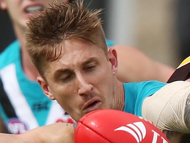 ADELAIDE, AUSTRALIA - MARCH 12: Luke Breust of the Hawks tackles Hamish Hartlett of the Power during the JLT Community Series match between the Port Adelaide Power and the Hawthorn Hawks at Hickinbotham, Oval on March 12, 2017 in Adelaide, Australia.  (Photo by Morne de Klerk/Getty Images)