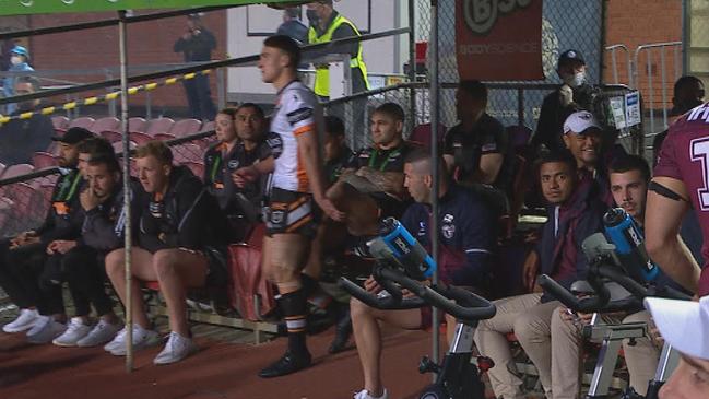 Josh Reynolds and Russell Packer in Wests Tigers dugout during the first half against Manly. Credit: Fox Sports