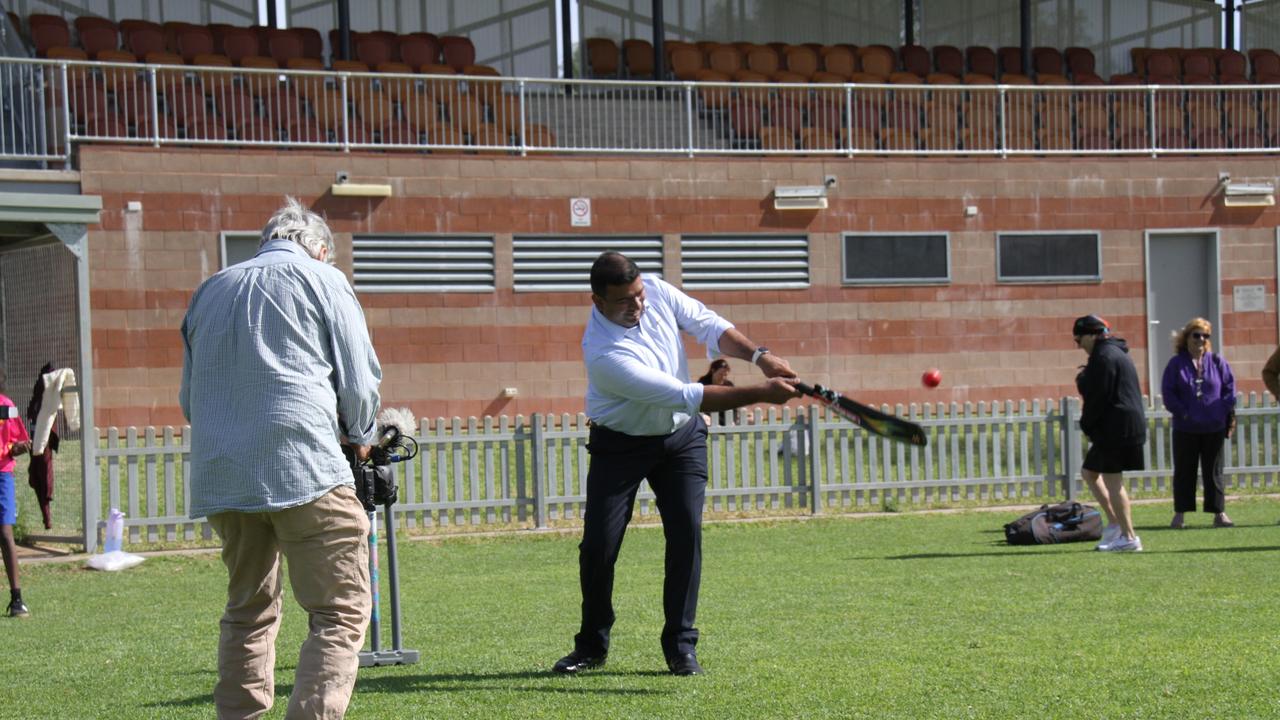 NT sports, people, and culture minister Jinson Charls hits NT planning minister Josh Burgoyne for a six Albrecht Oval in Larapinta, Alice Springs. Picture: Gera Kazakov