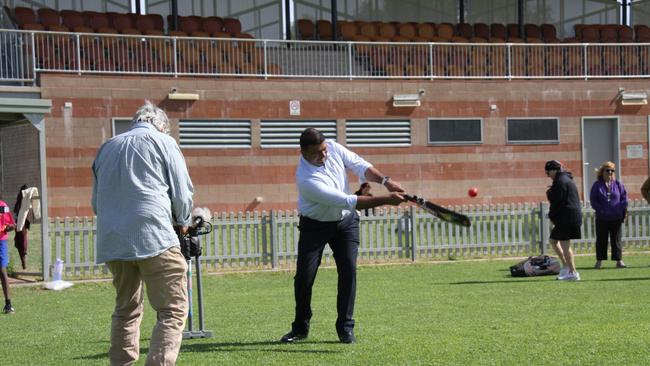 NT sports, people, and culture minister Jinson Charls hits NT planning minister Josh Burgoyne for a six Albrecht Oval in Larapinta, Alice Springs. Picture: Gera Kazakov