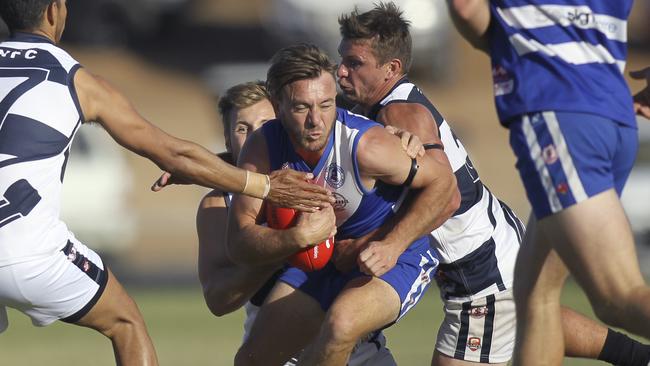 An old sock of Port Noarlunga’s Aaron Peterson, pictured with the ball, is now tied to the ‘sock trophy’. (AAP Image/Dean Martin)