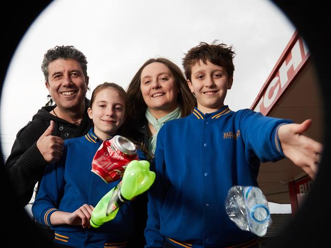 George Mappas and Leanne Dangerfield, with their kids Jessica and Antoni, drop recyling into their correct bins. Picture: Matt Loxton