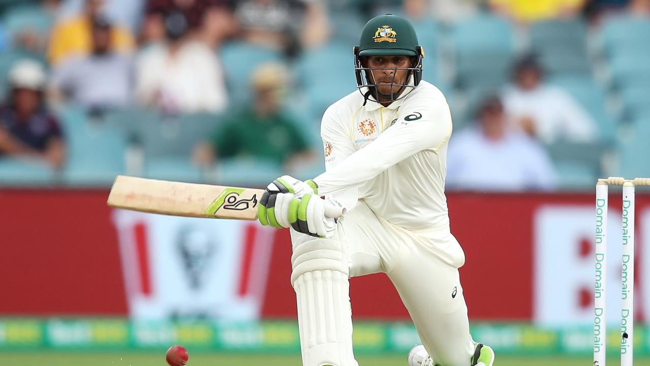 Usman Khawaja plays a reverse sweep in Canberra. Photo: Mark Kolbe/Getty Images.