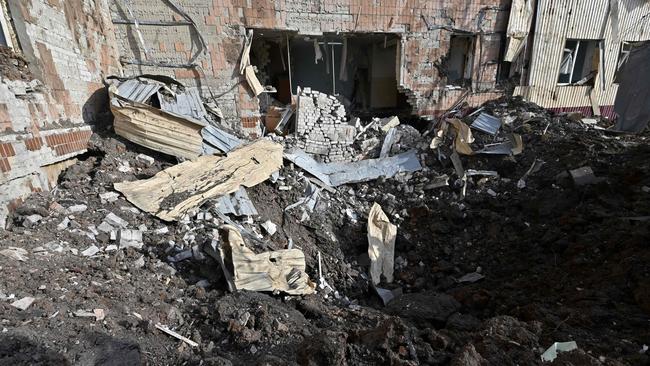 Churned up earth outside a destroyed boarding school following a missile strike in the city of Kharkiv. Picture: AFP