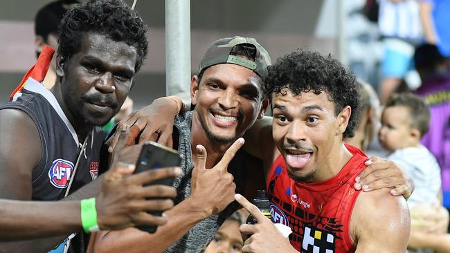 Malcolm Rosas of the Suns with fans. Photo by Felicity Elliott/AFL Photos via Getty Images