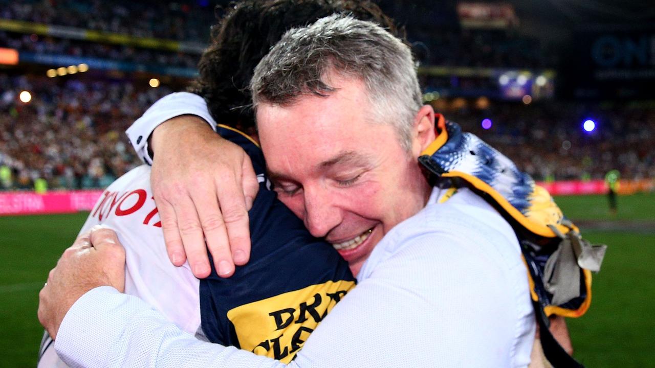 Johnathan Thurston celebrates with Cowboys coach Paul Green after winning the 2015 NRL Grand Final match. Picture: Cameron Spencer/Getty Images