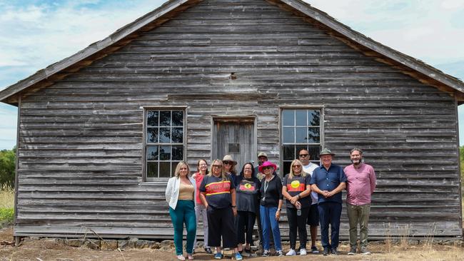 Donna, Tina and Joanne Wright stand with Yoorrook commissioners outside a Lake Condah Mission home. Picture: Brianna Young/Yoorrook Justice Commission