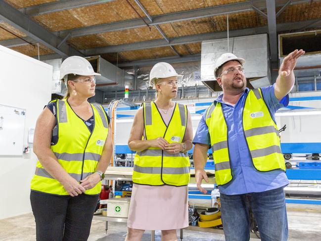 AMGC NT director Charmaine Phillips, Advanced Manufacturing Minister Nicole Manison and Arctic Installations managing director Gary Burns tour the workshop floor where cold room installation panels are prepared. Picture: Floss Adams.