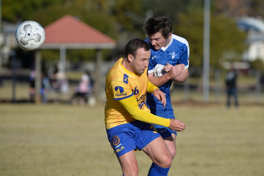 Nick Taylor (left) for USQ FC and Brodie Simpson of Rockville in Toowoomba Football League Premier Men round 14 at Captain Cook Reserve Des McGovern oval, Sunday, June 24, 2018. Picture: Kevin Farmer