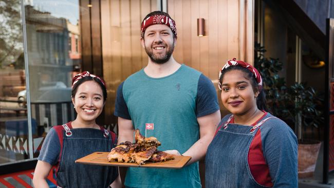 Nandos staff helping local families. Picture: Nandos