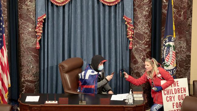 A protester sits in the Senate Chamber. Picture: AFP