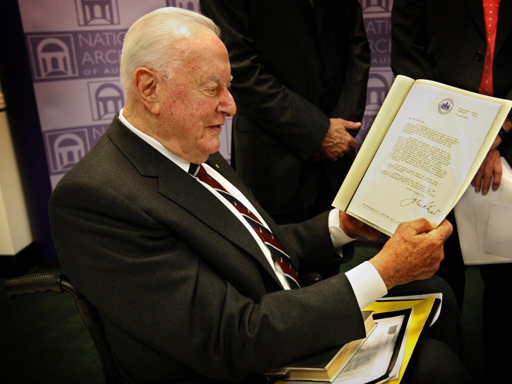 Gough Whitlam examines the letter of dismissal signed by then Governor-General John Kerr which dismissed the government on November 11th 1975, on display at the National Archives in Canberra.