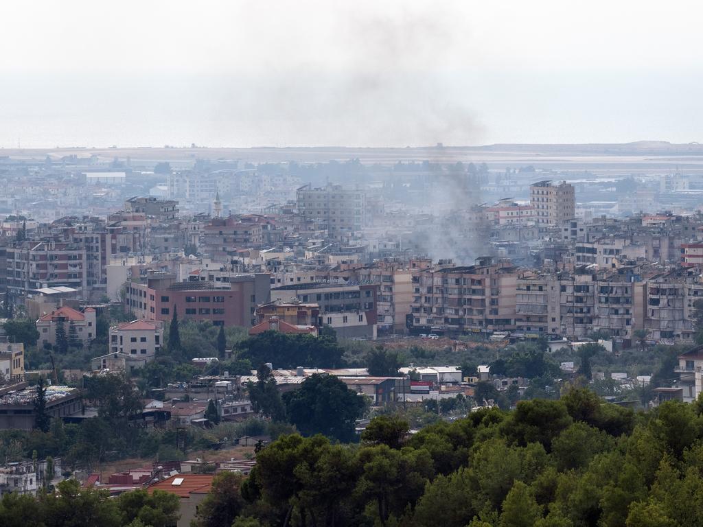 Smoke rises from the Hezbollah stronghold of Dahieh following Israeli air strikes on October 6.