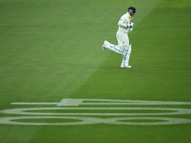 Michael Clarke runs past No.408 at Adelaide Oval. Picture: Morne de Klerk/Getty