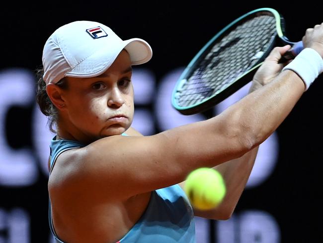 STUTTGART, GERMANY - APRIL 21:   Ashleigh Barty of Australia returns a backhand on day 5 of the Porsche Tennis Grand Prix match between Ashleigh Barty of Australia and Laura Siegemund of Germany at Porsche Arena on April 21, 2021 in Stuttgart, Germany.  (Photo by Philipp Guelland - Pool/Getty Images)