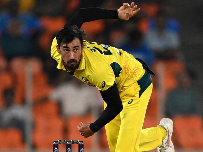 Australia's Mitchell Starc bowls during the 2023 ICC Men's Cricket World Cup one-day international (ODI) match between England and Australia at the Narendra Modi Stadium in Ahmedabad on November 4, 2023. (Photo by Money SHARMA / AFP) / -- IMAGE RESTRICTED TO EDITORIAL USE - STRICTLY NO COMMERCIAL USE --