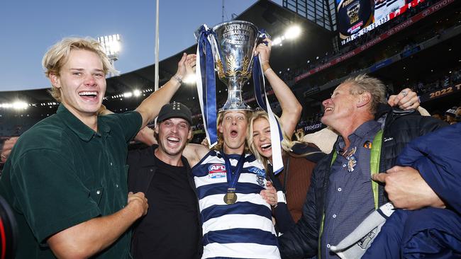 MELBOURNE, AUSTRALIA - SEPTEMBER 24: Sam De Koning of the Cats celebrates with family and friends after winning the 2022 AFL Grand Final match between the Geelong Cats and the Sydney Swans at the Melbourne Cricket Ground on September 24, 2022 in Melbourne, Australia. (Photo by Daniel Pockett/AFL Photos/via Getty Images)