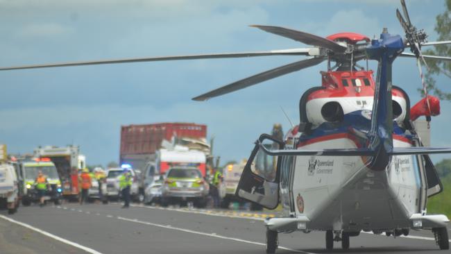 The QGAir rescue helicopter landed on the Bruce Highway to assist after a multi-vehicle crash near Giru. Picture: Satria Dyer-Darmawan