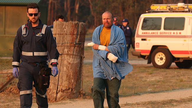 Wytaliba fire survivor Mirek, who fought to save his home, is evacuated by chopper with burns the day after a fierce bush fire claimed the lives of two people in the area. Picture: Lyndon Mechielsen