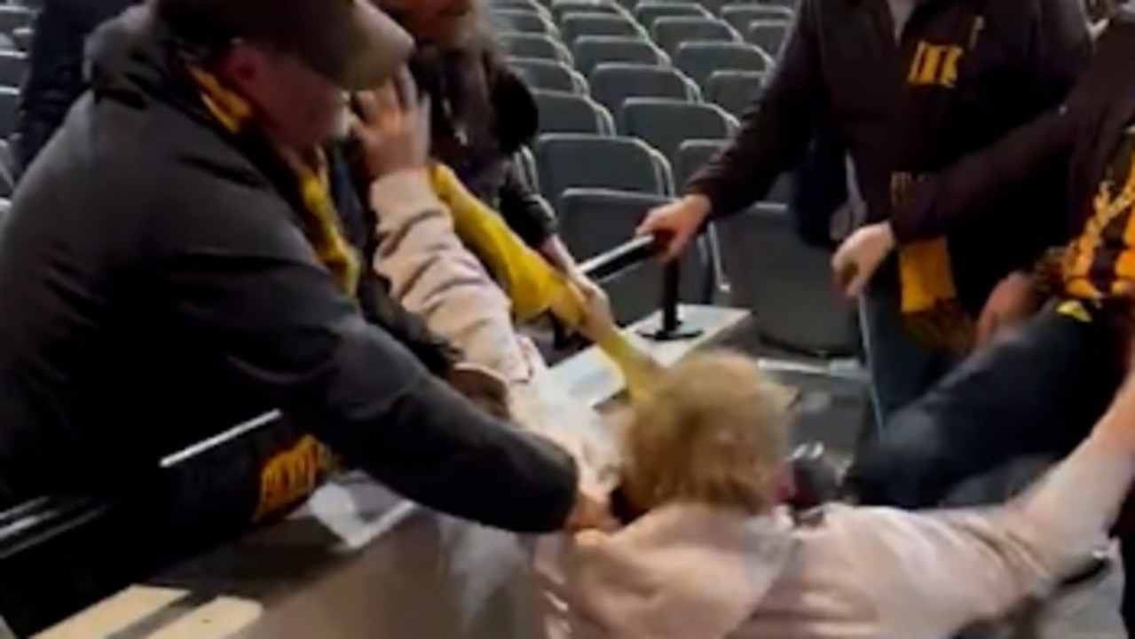 Kicks fly, punches thrown in ugly footy fan brawl at MCG