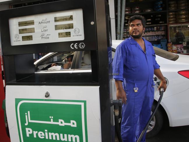 A worker refuels a car at a petrol station in Jiddah. Saudi Arabia’s energy minister said more than half of its daily crude oil production had been restored. Picture: AP