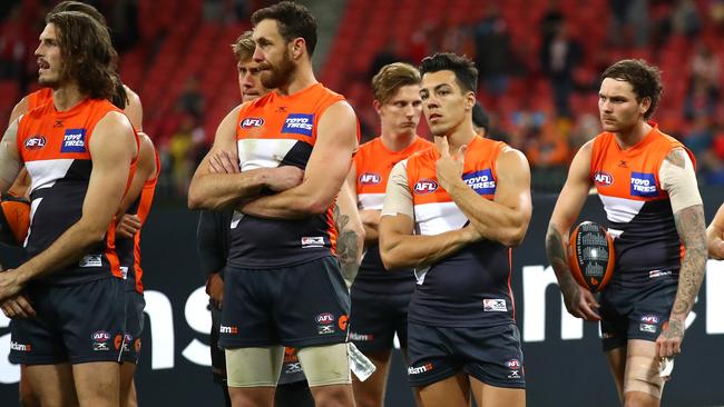 Giants players look dejected. (Photo by Cameron Spencer/AFL Media/Getty Images)