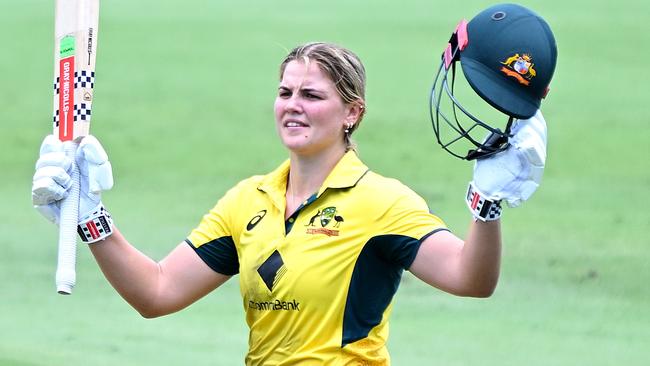 BRISBANE, AUSTRALIA - DECEMBER 08: Georgia Voll of Australia celebrates after scoring a century during game two of the Women's One Day International Series between Australia and India at Allan Border Field on December 08, 2024 in Brisbane, Australia. (Photo by Bradley Kanaris/Getty Images)