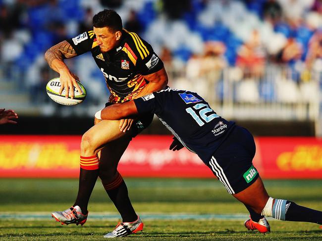 Chiefs centre Sonny Bill Williams looks to offload against the Blues.