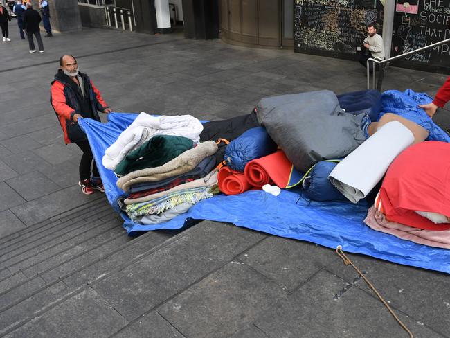 Lanz Priestly, known as the Mayor of Tent City, packing up this morning. Picture: David Moir