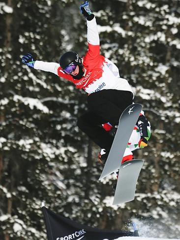 Australia's Jarryd Hughes races during the men's World Cup snowboard cross event in Lake Louise, Canada.