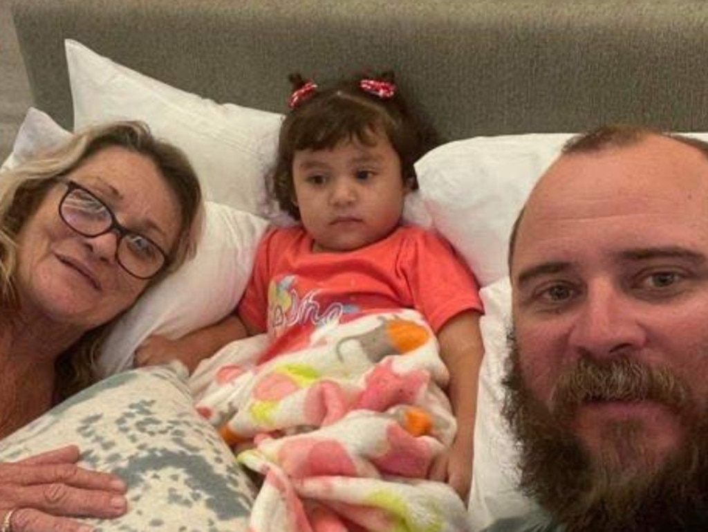 Adelynn, 2, has been reunited with her Mackay uncle Ben Shanks and Brisbane grandmother Leanne in Cancun in Mexico after she was dumped at church. Her parents remain missing. Picture: Contributed