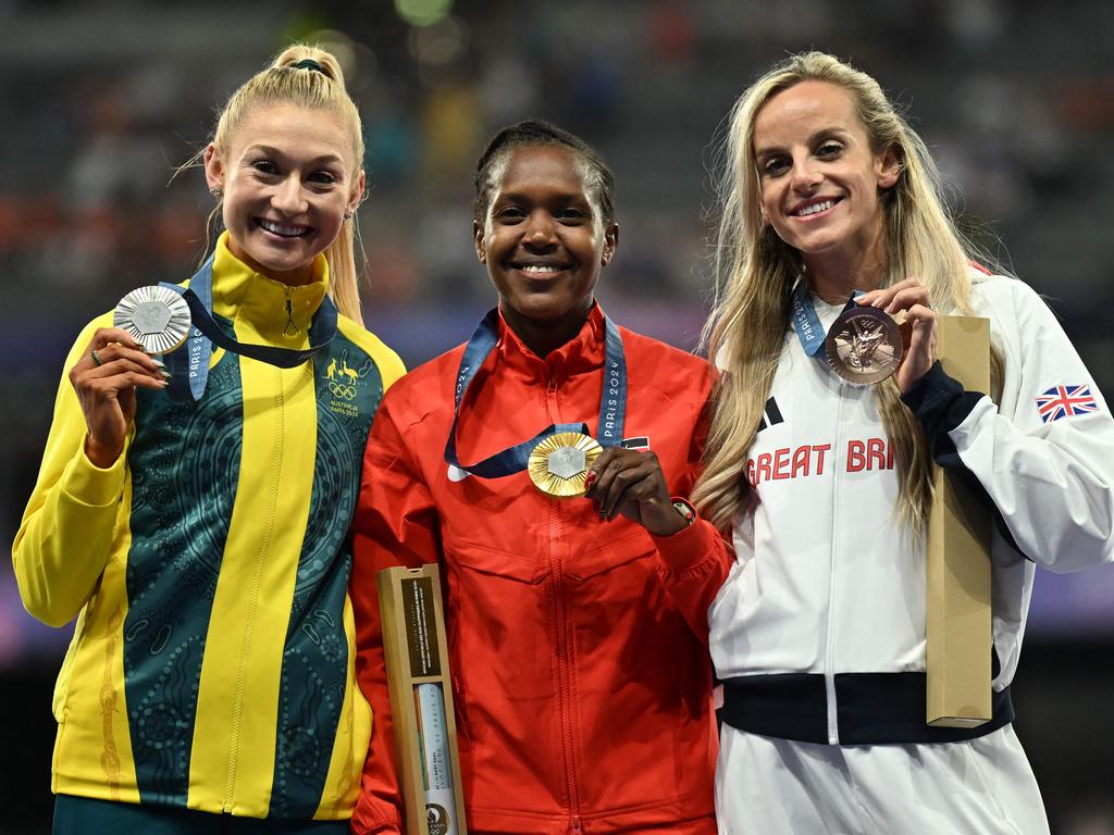 Hull’s silver medal caps a remarkable season. She’s pictured on the podium with gold medallist Kenya's Faith Kipyegon and bronze medallist Britain's Georgia Bell. Picture: Martin Bernetti/AFP