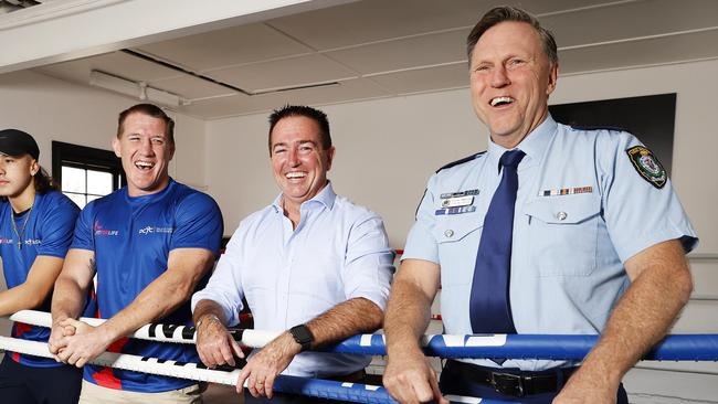 Assistant Commissioner Gavin Wood, right, is using his sporting contacts to help young men make better choices in life. Picture: Tim Hunter