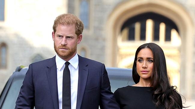 WINDSOR, ENGLAND - SEPTEMBER 10: Prince Harry, Duke of Sussex, and Meghan, Duchess of Sussex on the long Walk at Windsor Castle arrive to view flowers and tributes to HM Queen Elizabeth on September 10, 2022 in Windsor, England. Crowds have gathered and tributes left at the gates of Windsor Castle to Queen Elizabeth II, who died at Balmoral Castle on 8 September, 2022. (Photo by Chris Jackson/Getty Images)