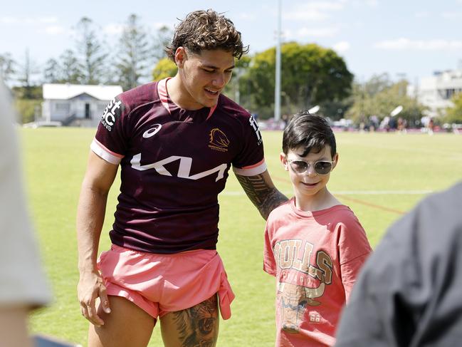 Reece Walsh with a young fan at Red Hill on Monday. Picture: Josh Woning