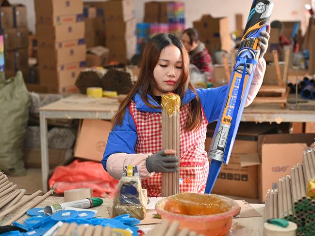LIUYANG, CHINA - JANUARY 30: Employees make fireworks at a factory ahead of Chinese Lunar New Year, the Year of the Dragon, on January 30, 2024 in Liuyang, Changsha City, Hunan Province of China. (Photo by Yang Huafeng/China News Service/VCG via Getty Images)