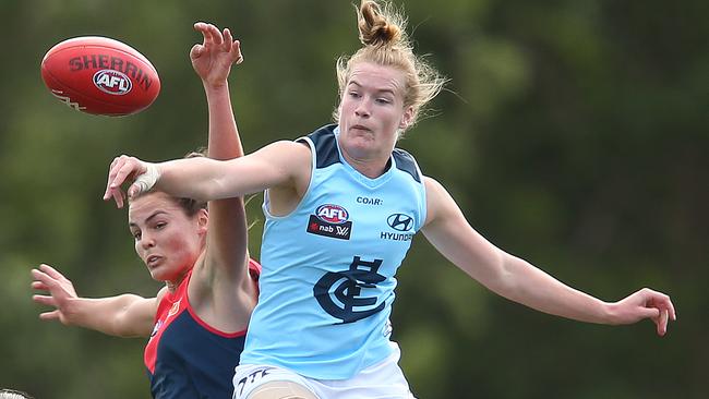 Maddie Boyd (Melbourne) and Breann Moody (Carlton) in a ruck contest. Picture: David Crosling