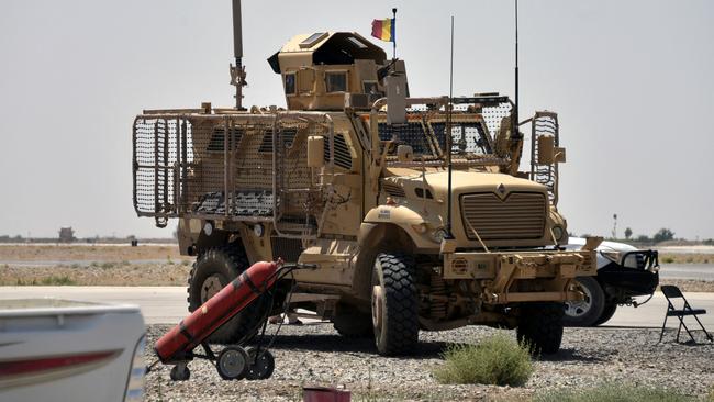 A NATO armoured vehicle patrols inside a US military base in Kandahar last week. Picture: AFP