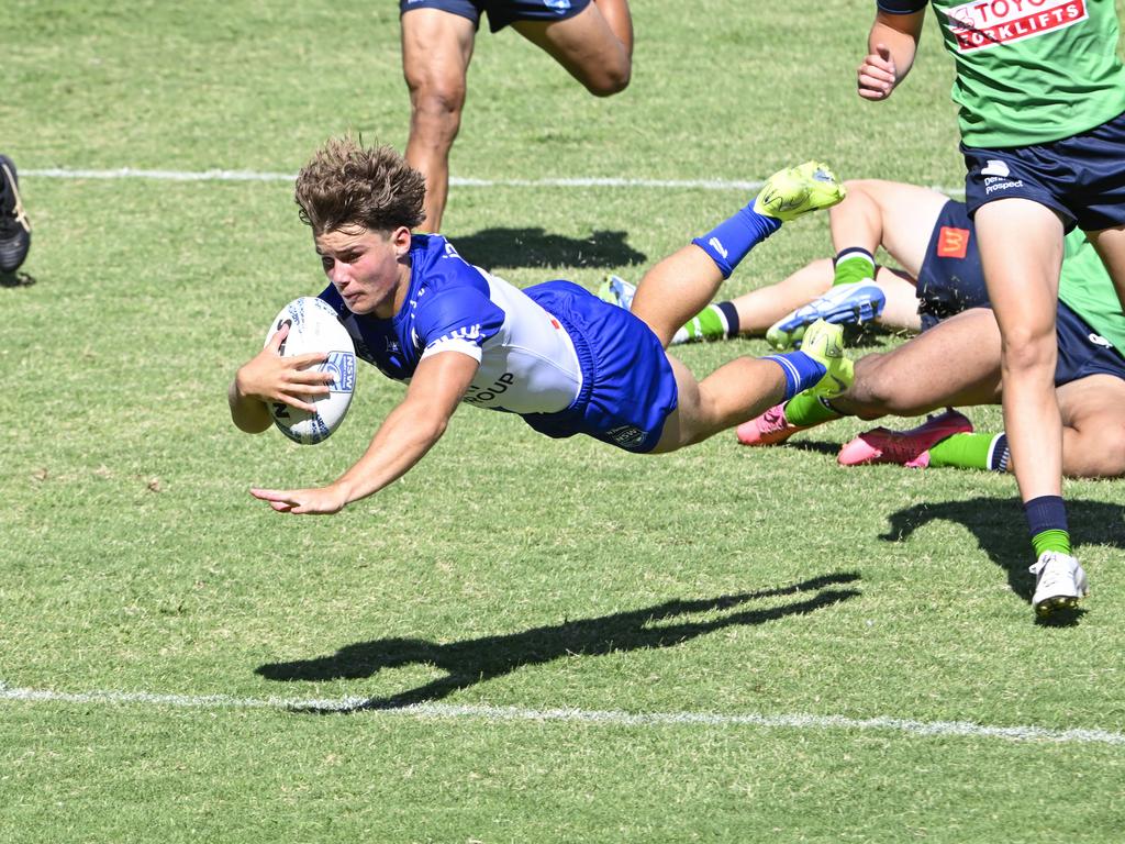 Jai Callaghan dives for a try. Picture: Martin Ollman