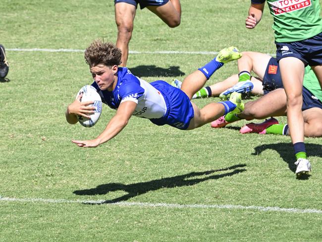 Jai Callaghan dives for a try. Picture: Martin Ollman