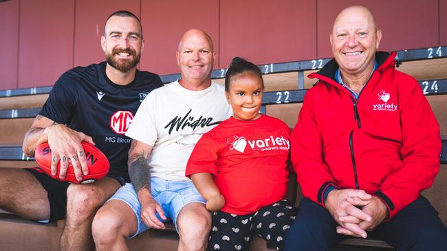 Port star Charlie Dixon, David Grigg, Mackayla and Variety CEO Mark McGill at Alberton Oval. Picture: Supplied