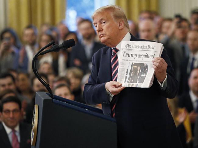 Donald Trump again held up a newspaper with the headline that reads "Trump acquitted". Picture: AP