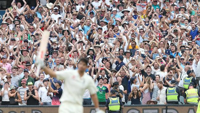 The Barmy Army give a standing ovation to Alistair Cook as he brings up his 200. Picture: Michael Klein