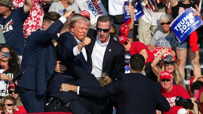 Donald Trump gestures to the crowd after the assassination attempt. Picture: AFP