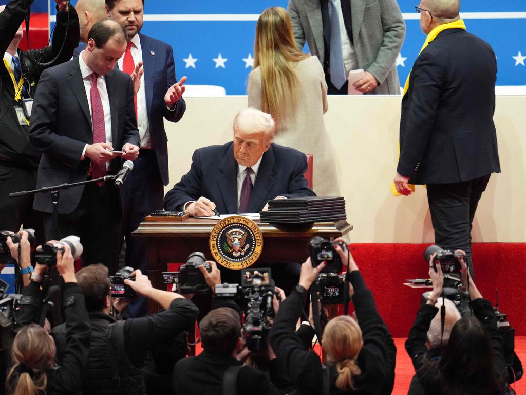 Mr Trump onstage during an indoor inauguration parade at Capitol One Arena. Picture: Christopher Furlong/Getty Images/AFP