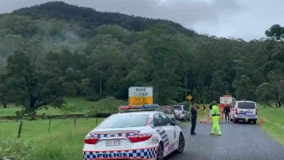 Two police vehicles have been caught in floodwaters in Tallebudgera during a search for a missing woman. Picture: 1029 Hot Tomato