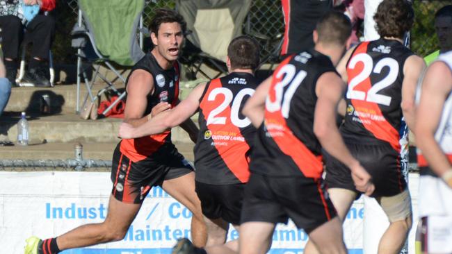 Player of the match Troy Menzel boots one of his two goals for Tea Tree Gully in the 30-point win. Picture: AAP Image/ Brenton Edwards