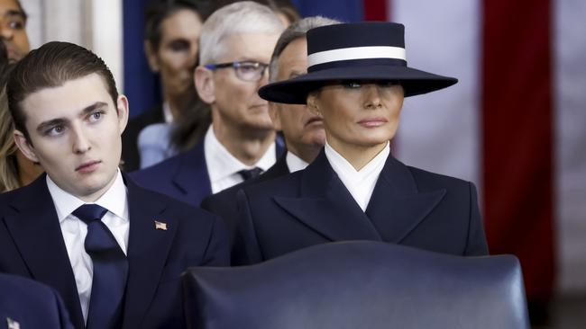 First Lady Melania Trump gives side eye under her controversial hat next to son Barron while husband Donald speaks after being sworn in as 47th president. Picture: Shawn Thew-Pool / Getty