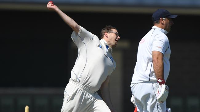 Matthew Kent rolls the arm over for Greenvale Kangaroos.