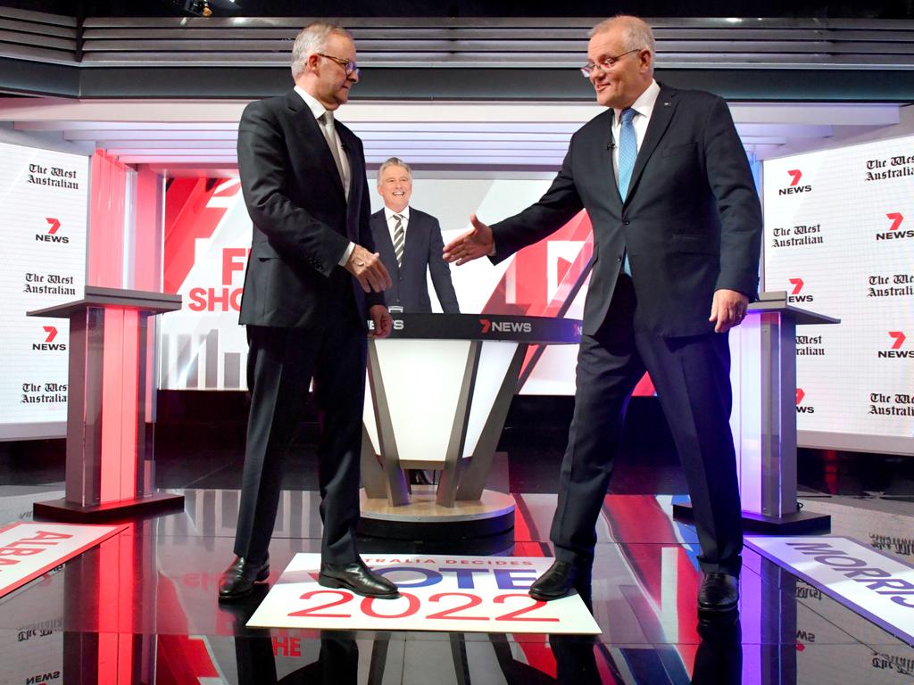 Australian Prime Minister Scott Morrison and Australian Opposition Leader Anthony Albanese shake hands during the third leaders' debate on Wednesday. Picture: Mick Tsikas/AAP